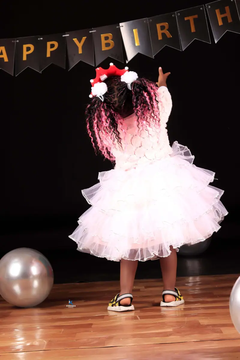 Little girl in a white tutu dress at a kids birthday photo shoot