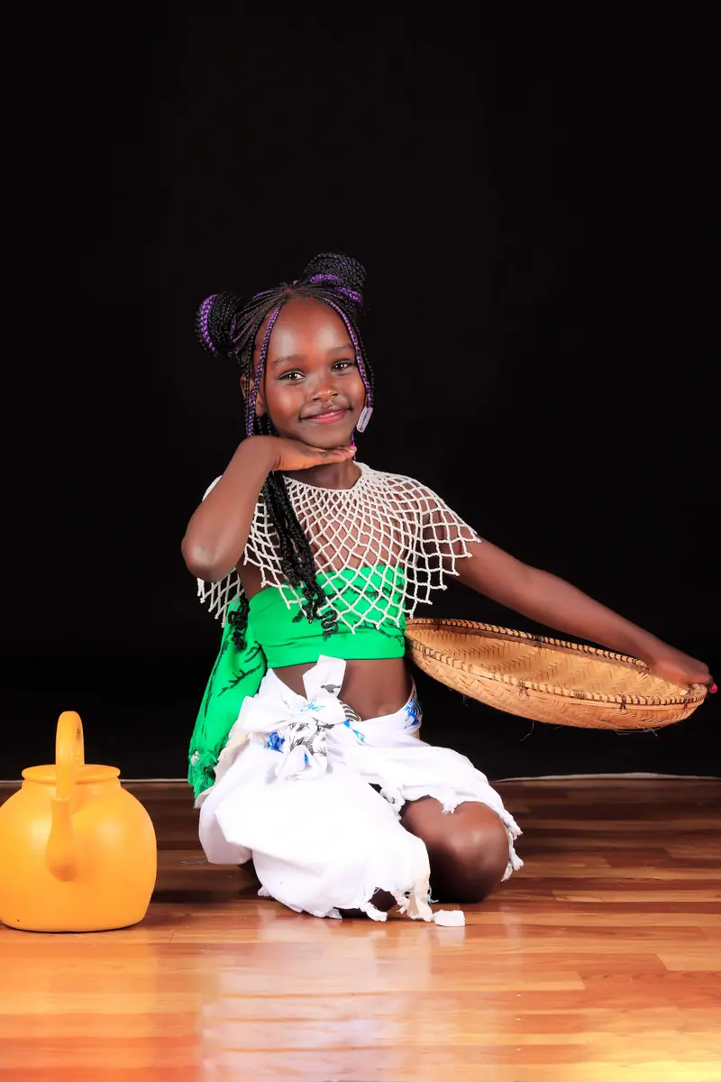 Smiling young girl in a cultural outfit during a studio kids portrait session