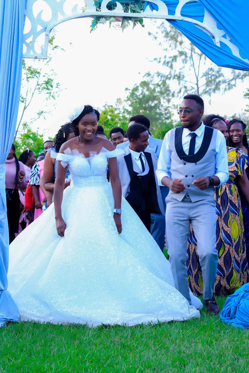 Bride and groom celebrating with their guests at an outdoor wedding