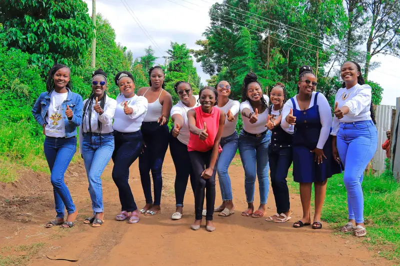 Group of friends posing together for an outdoor photo in Njoro